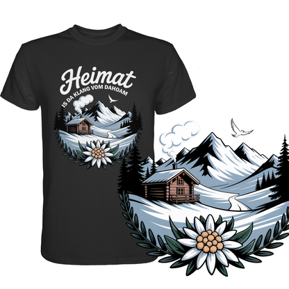 Schwarzes T-Shirt mit der Aufschrift „Heimat is da Klang vom Dahoam“ und Motiv: Berghütte, Berge und Edelweiß. Rechst unten eine vergrößerte Darstellung des Motivs.